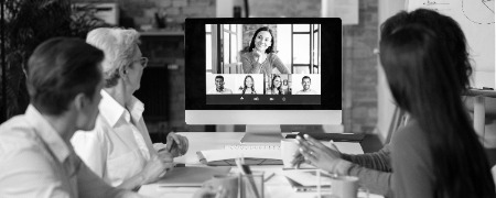 people using digital device while meeting photoaidcom greyscale 450x180