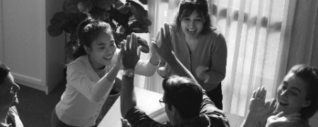 smart team give high five celebrate successful idea meeting symposium photoaidcom greyscale 450x180