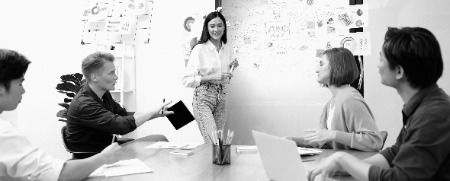 beautiful leader presents marketing strategy business meeting immaculate photoaidcom greyscale 450x181