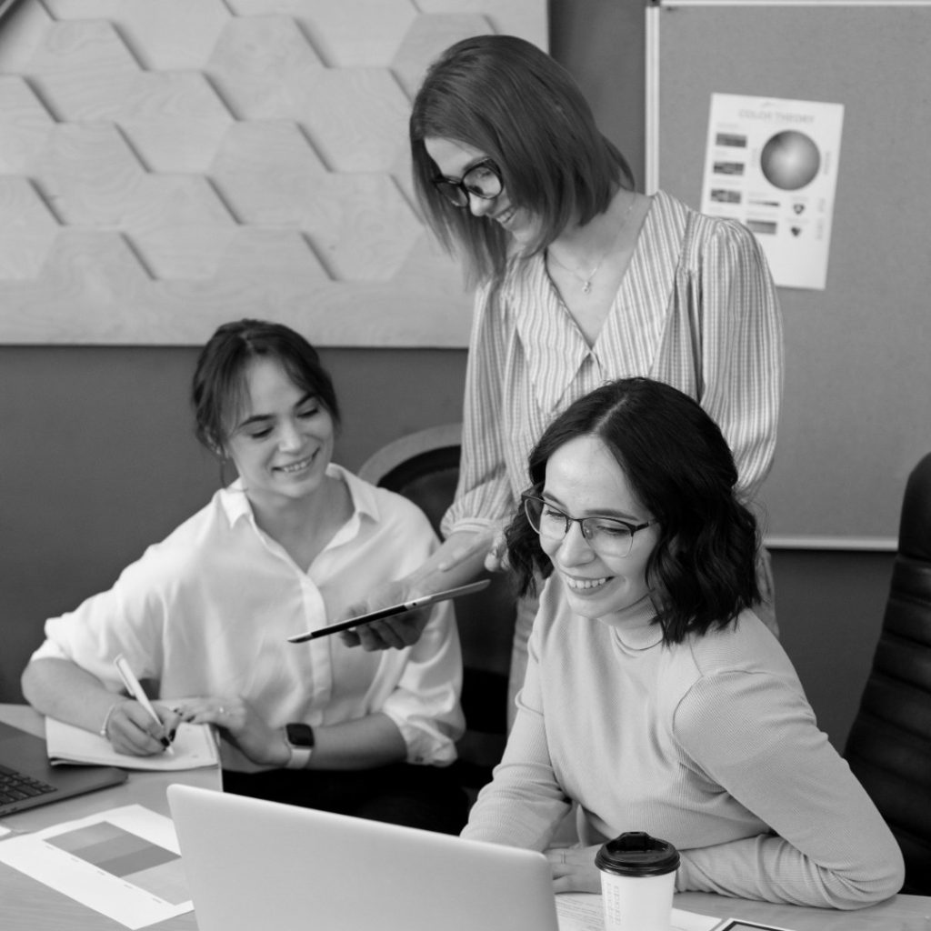 medium shot smiley women work photoaidcom greyscale 1080x1080